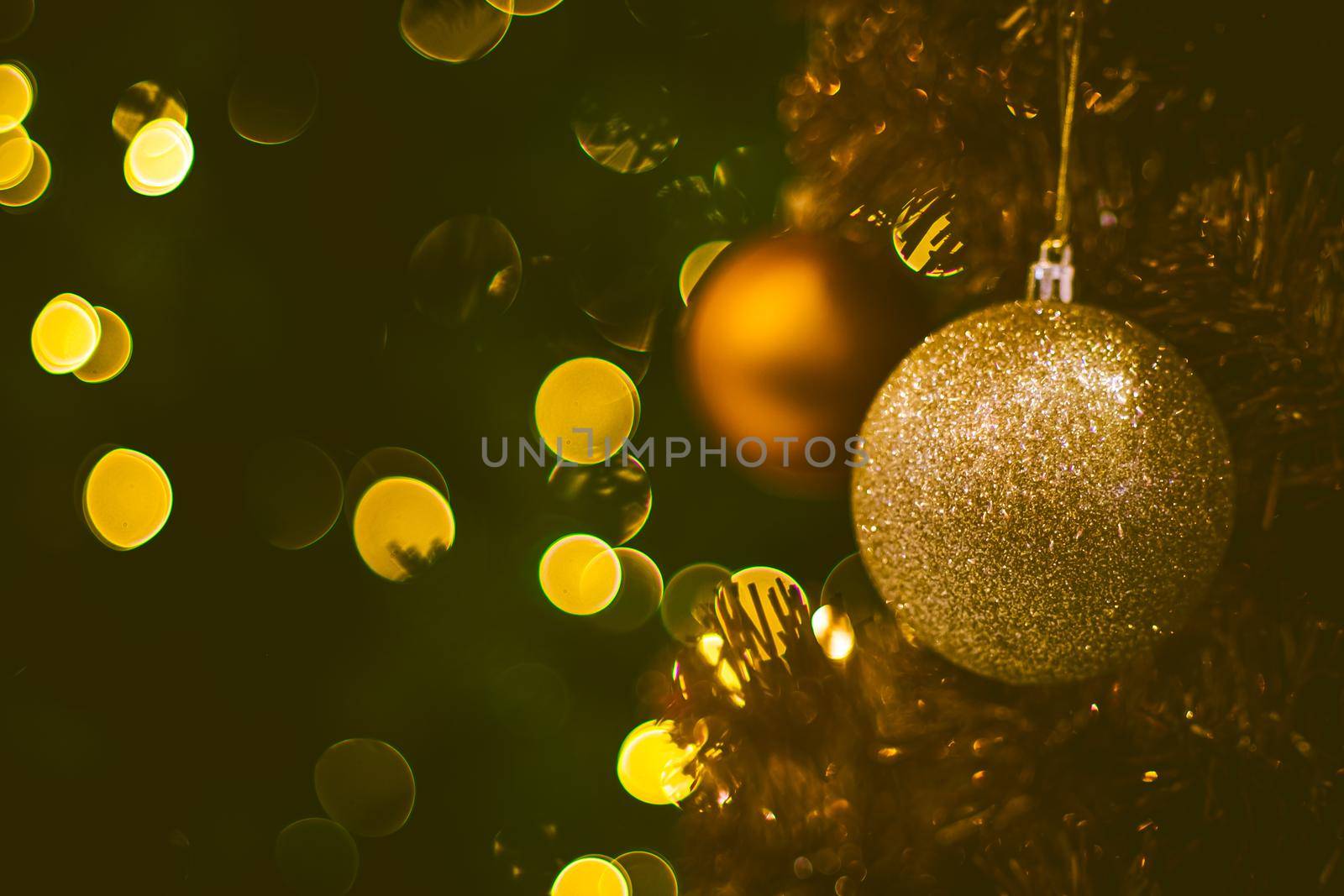 Christmas ball decoration on yellow background. Colorful blur bokeh background. christmas background by Petrichor