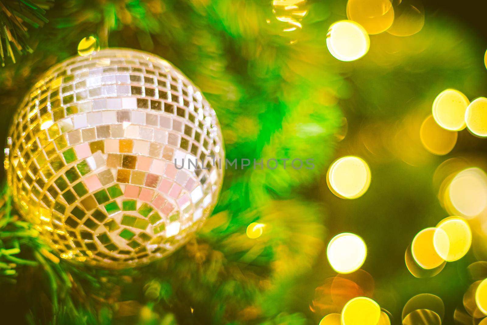 Christmas glitter ball decoration on bokeh background. Colorful blur bokeh background. christmas background