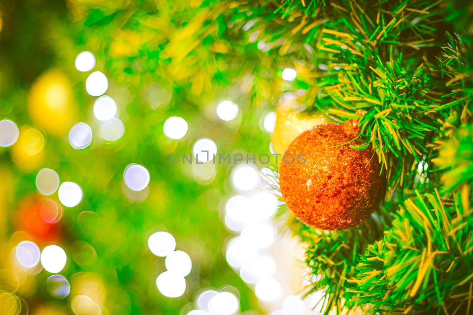 Close up red Christmas ball decoration on bokeh background. Colorful blur bokeh background. christmas background
