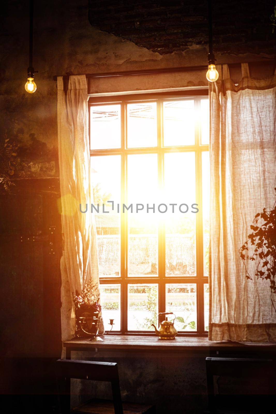 Golden light through window inside room in the morning. Hommie  house design.