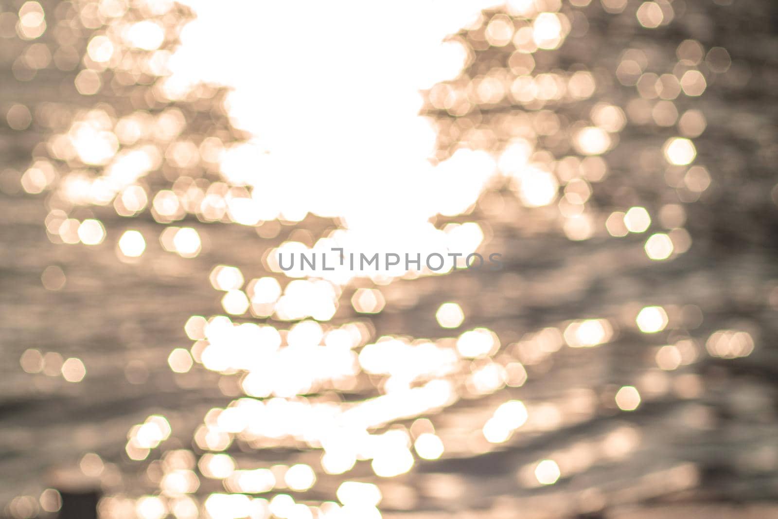 Abstract bokeh water blurred Summer background. Texture of defocused water surface by Petrichor