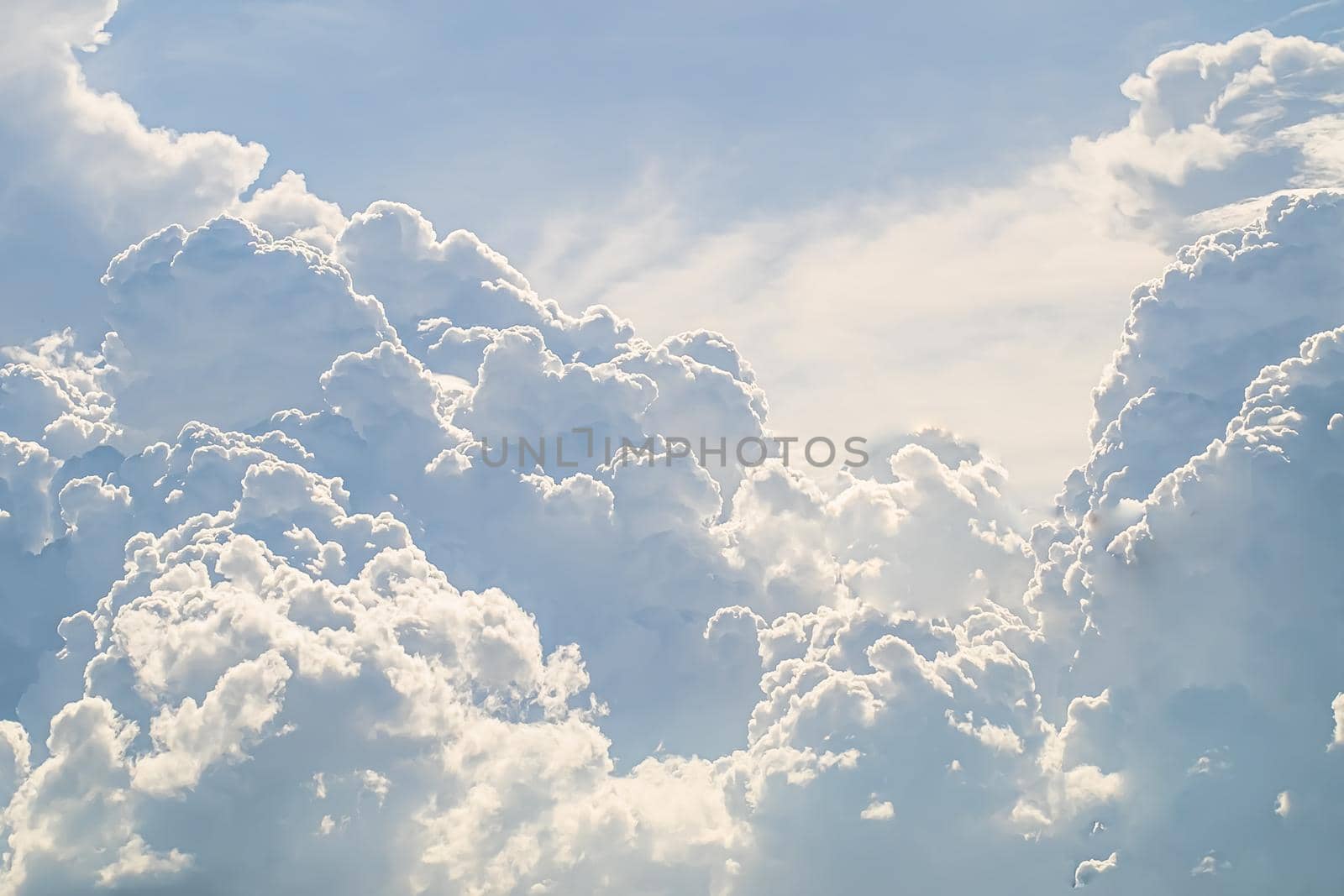huge White fluffy cloud against  blue sky summer abstract weather background.