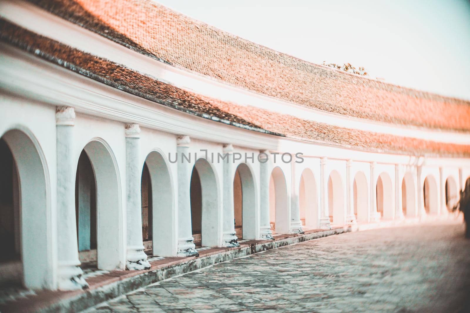 Arch walkway of Phra Pathom Chedi landmark architecture in Thailand.