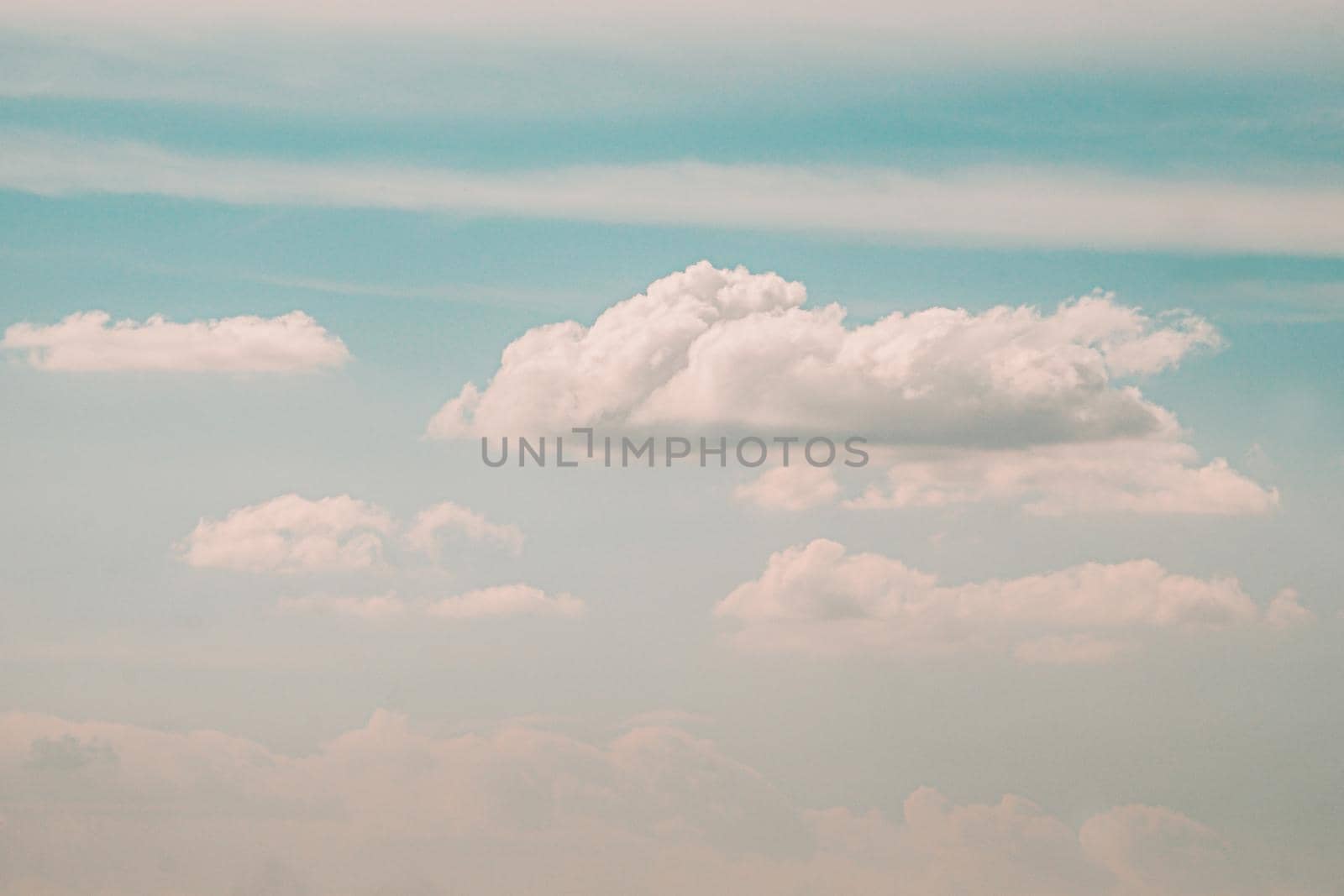 Beautiful white fluffy clouds sky background abstract season and weather. by Petrichor