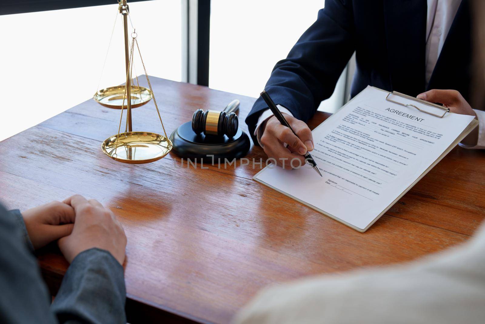 The hand of a business man is using the index finger to let the customer sign the contract, contract, business agreement