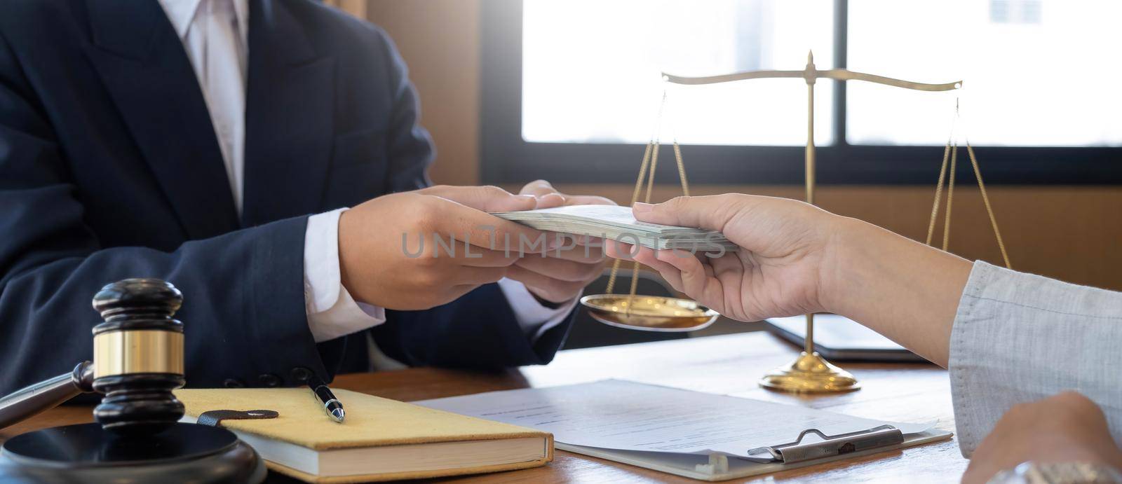 lawyer or judge is taking a bribe. In the client's courtroom at the lawyer's office In order to bribe to gain an advantage in the form of lawsuits, the concept of bribery and corruption in law by wichayada
