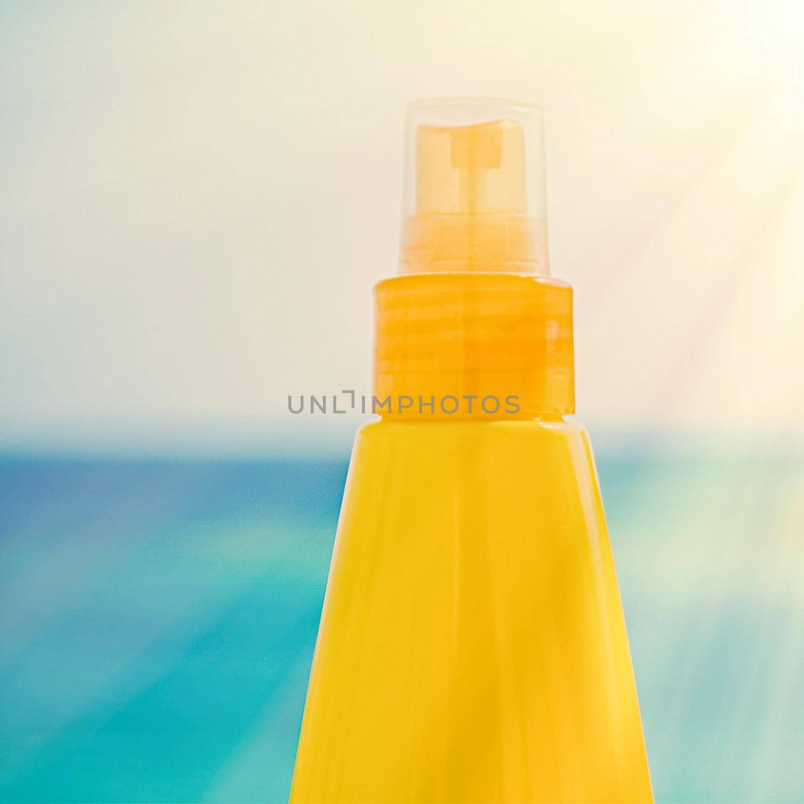 sun tan lotion on the beach - skincare cosmetics and holiday concept by Anneleven