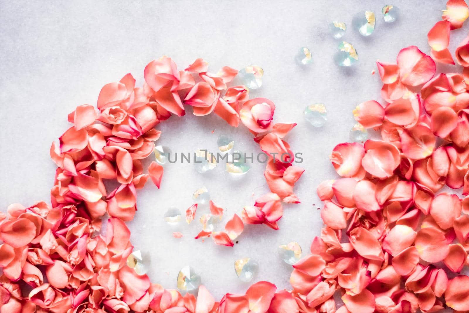 coral rose petals on marble, color of the year - flower backgrounds and holidays concept by Anneleven
