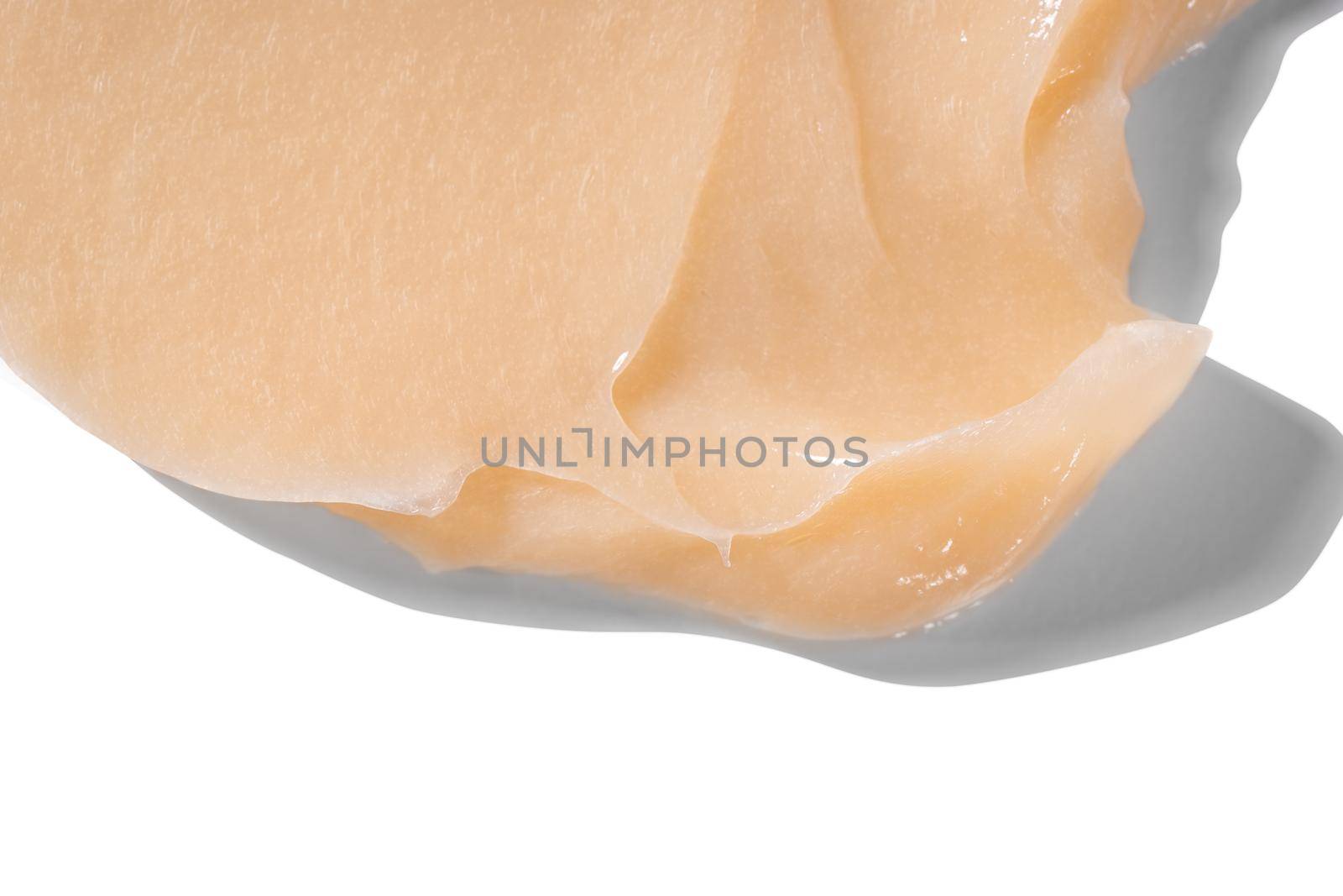 Hair conditioner cream swatch smear on white background. Yellow cosmetic lotion moisturiser sample closeup. Body care balm, retinol serum, shampoo wavy texture. Skincare mask, creamy cleanser by photolime