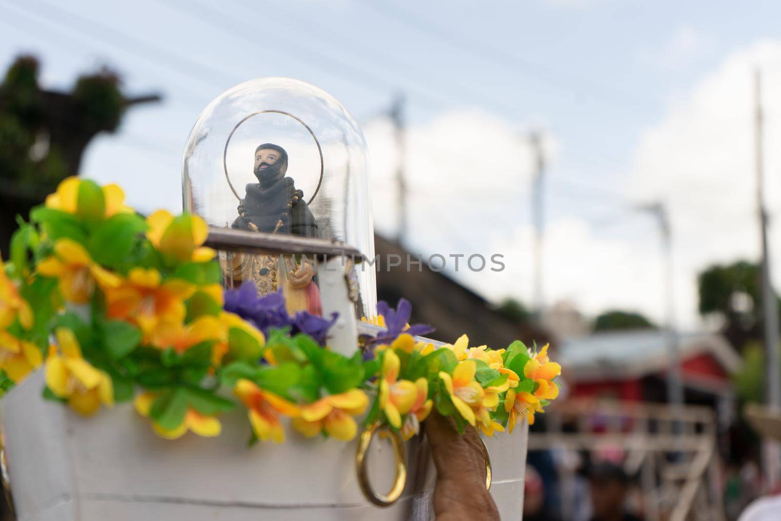 Image of Santo Domingo de Guzman in miniature traveling in a small boat in the Managua festivities by cfalvarez