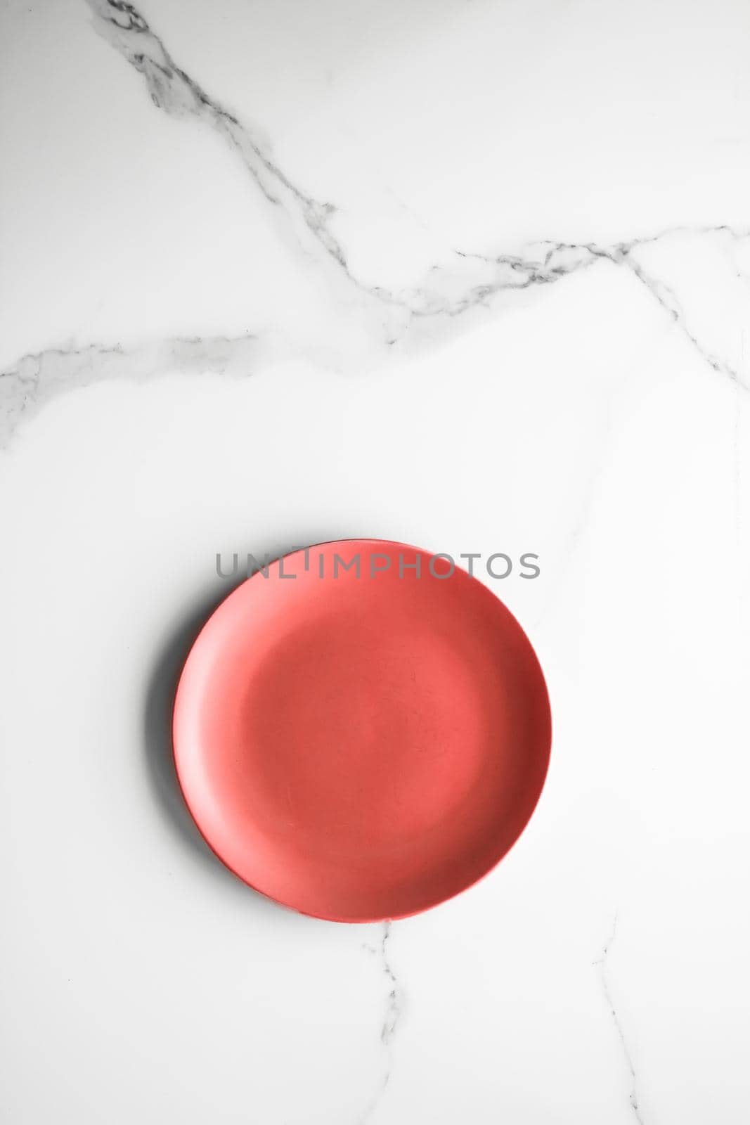 empty red plate on marble - recipe and restaurant mockup flatlay styled concept