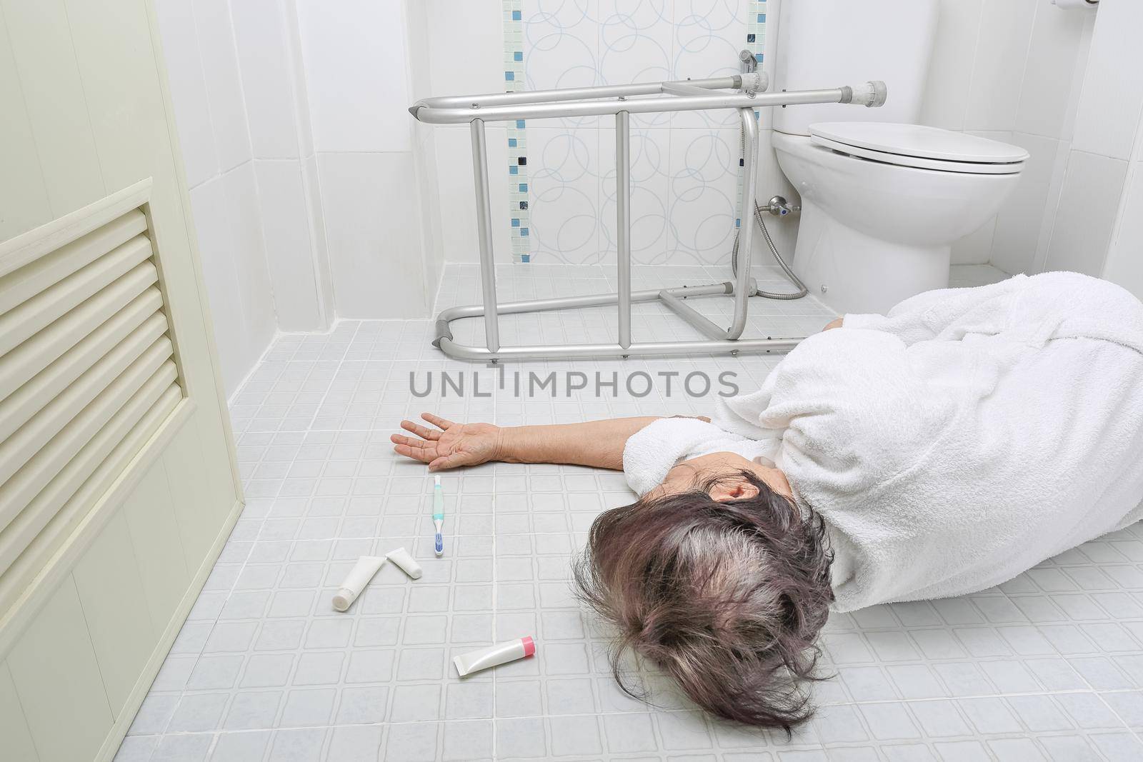 Elderly woman falling in bathroom because slippery surfaces