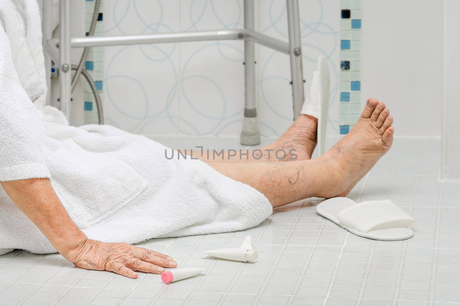 Elderly woman falling in bathroom because slippery surfaces