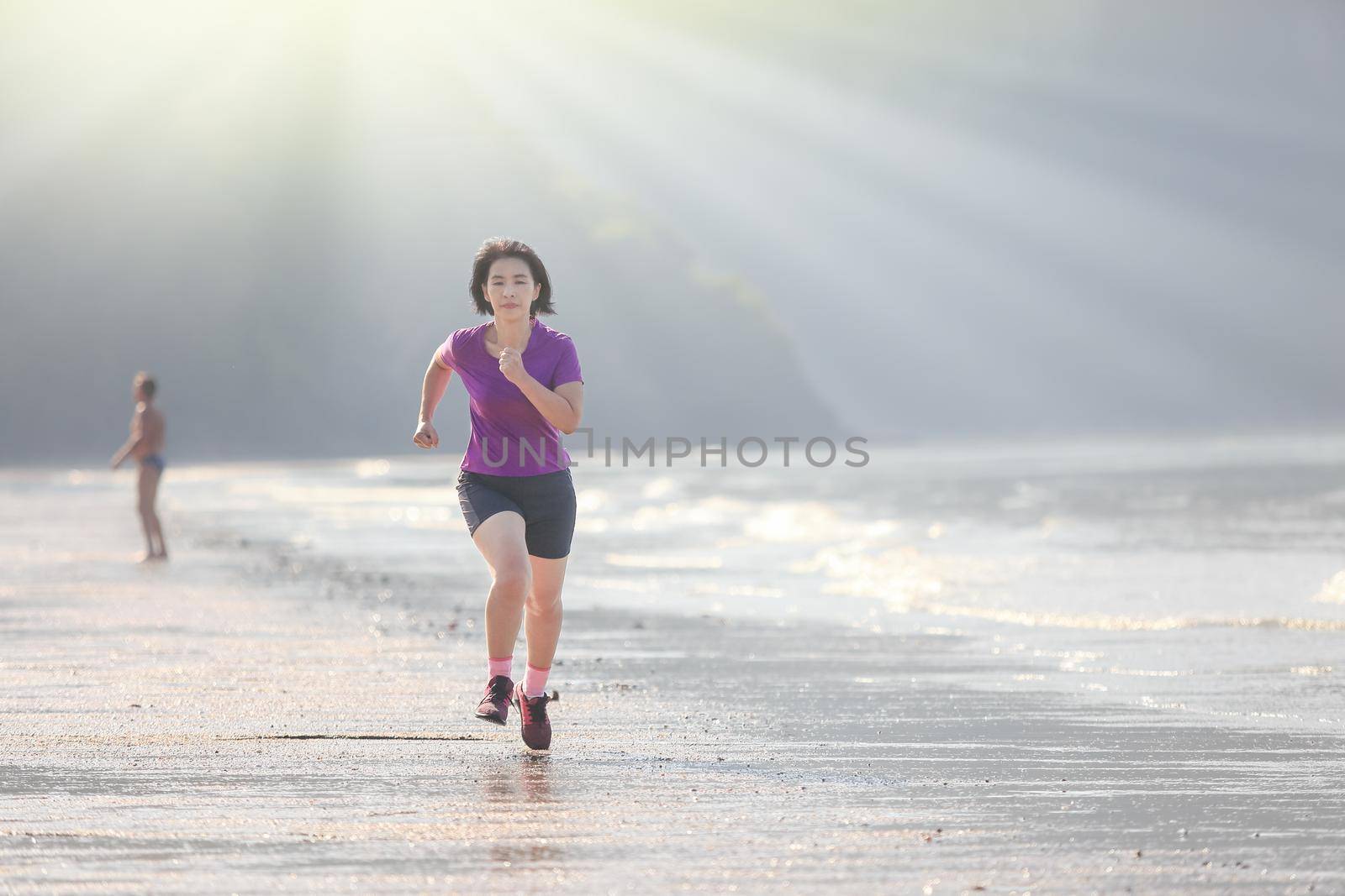 Fitness runner woman on ao nang beach , Krabi , Thailand