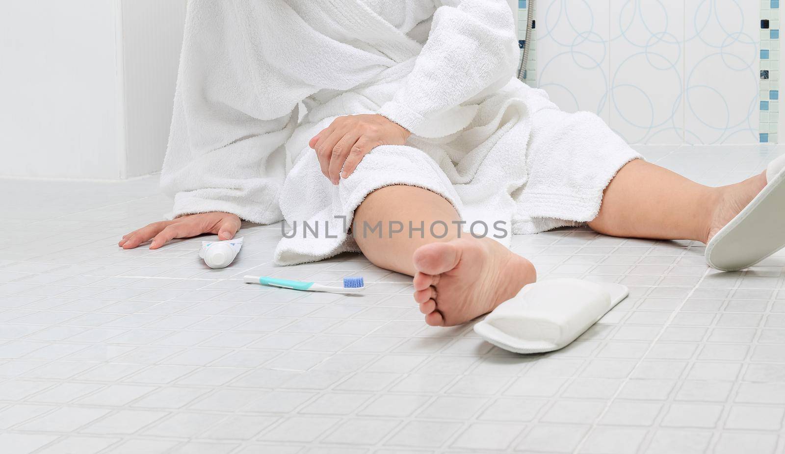 Woman falling in bathroom because slippery surfaces