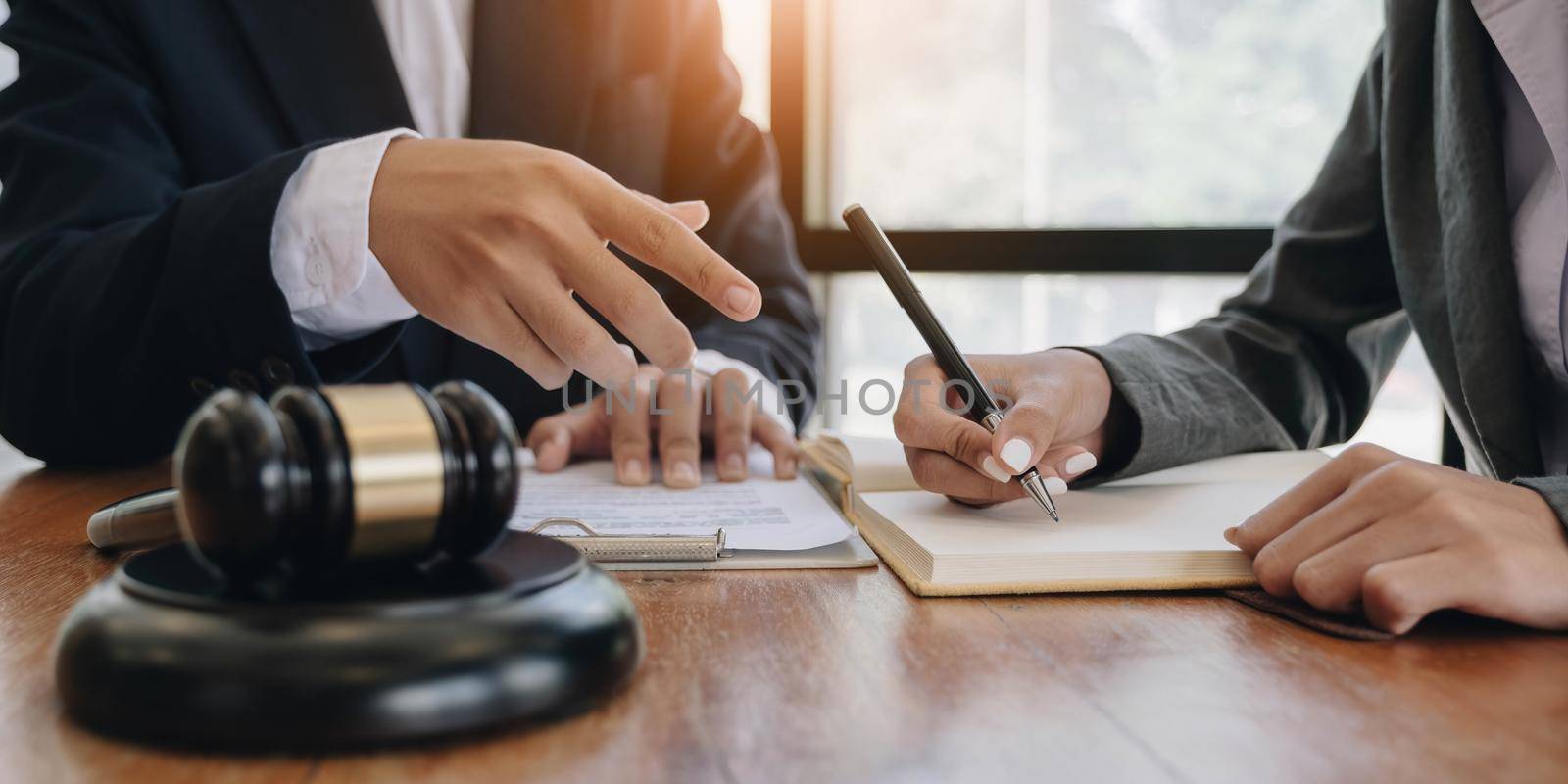 Consultation of Businessman or lawyer team meeting with client, Law and Legal services concept, Good service cooperation, Hands using tablet and laptop..