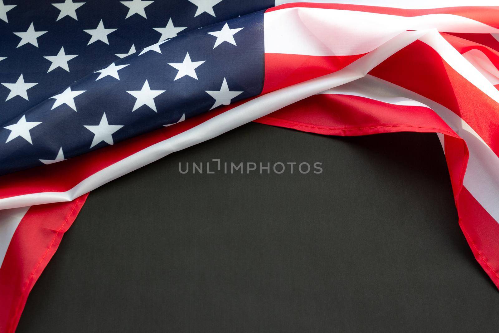 Flag of USA on black background with copy space. Concept of the patriotic holidays: presidents, mlk, independence, memorial, veteran, labor, columbus