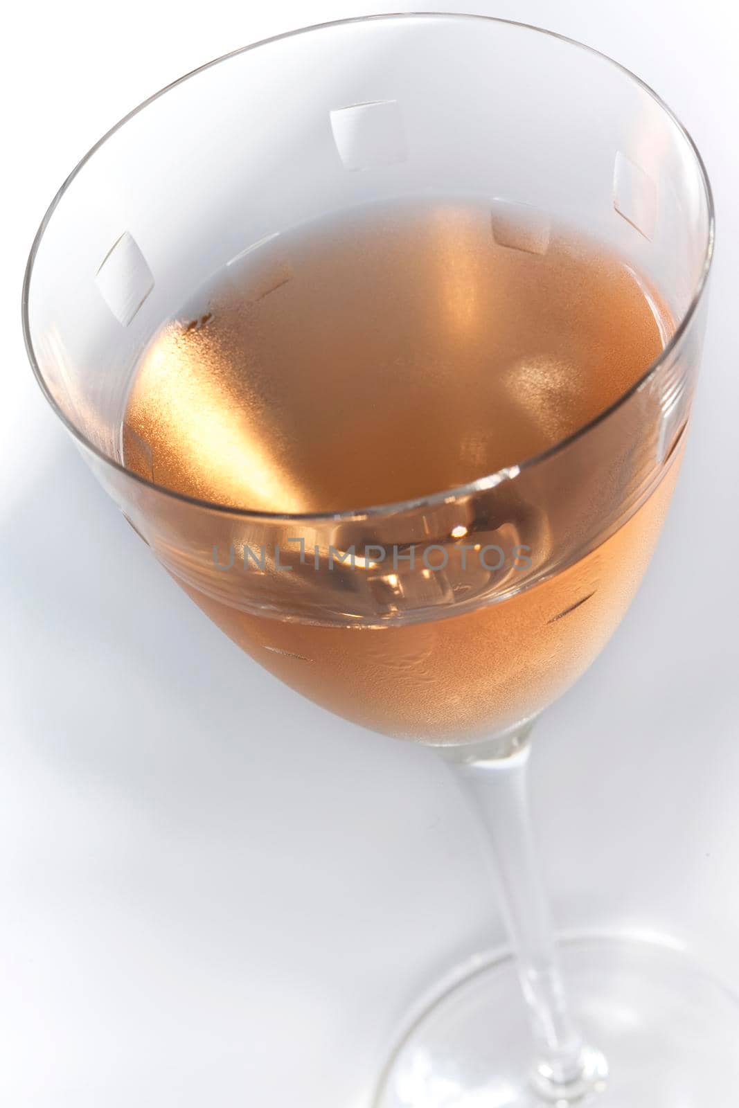 Close up of rose wine on a crystal glass