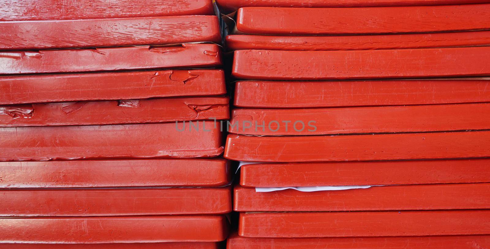 Plates of gelatin stacked in two piles. Remelted gelatin in the form of plates.