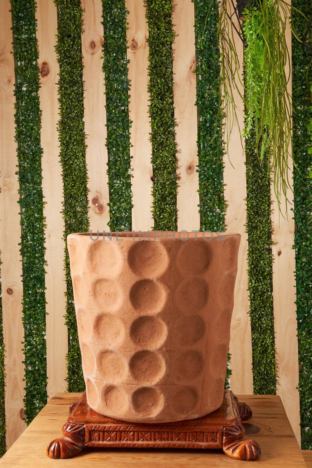 earthenware pot for plants on a wooden table by JpRamos
