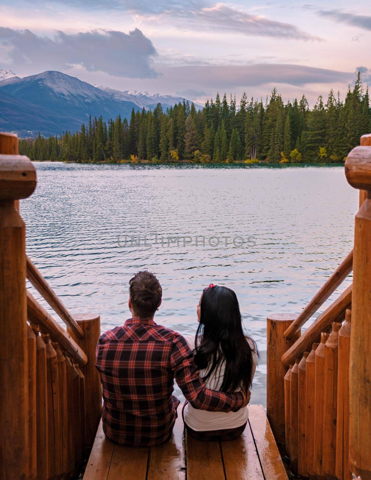 couple at beauvert lake, sunrise by lake at Jasper , Lac Beauvert Alberta Canadian Rockies Canada by fokkebok