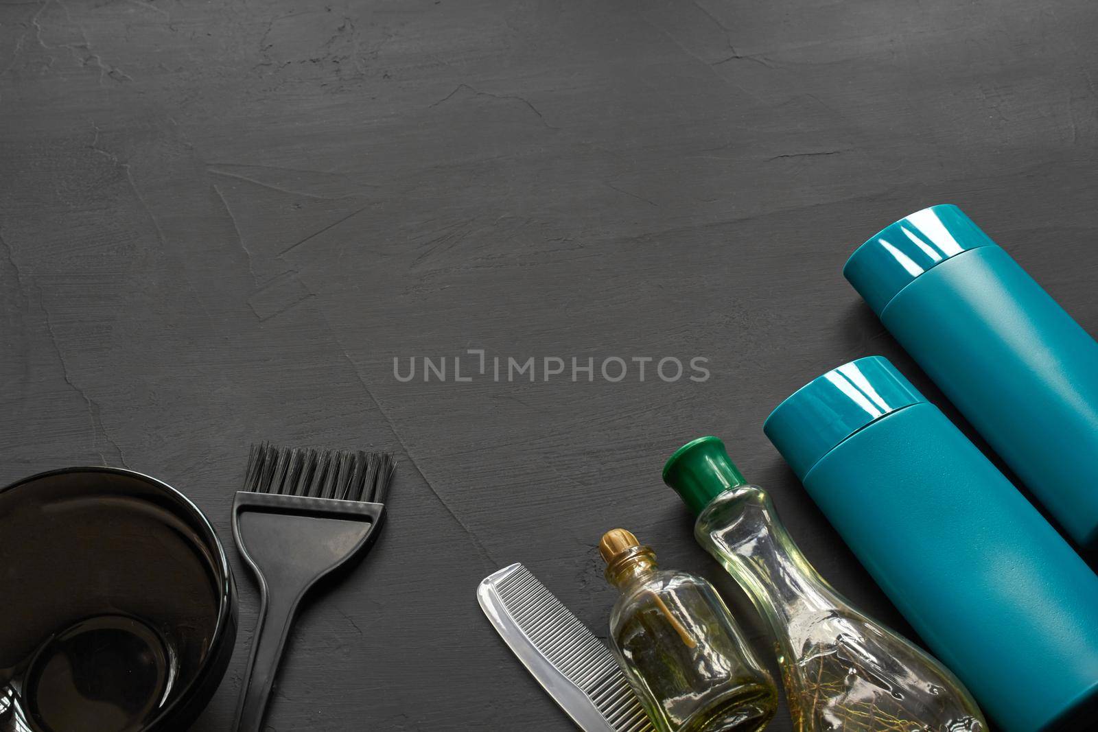 Top view of a professional hairdresser kit with copy space on a black background. by nazarovsergey