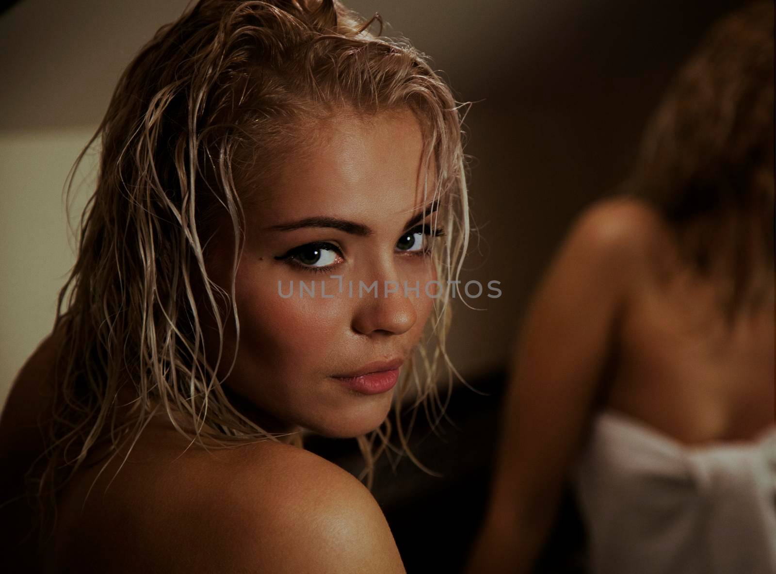 Portrait of a beautiful attractive sexy and sensuality young adult pretty blonde woman after bath relaxing