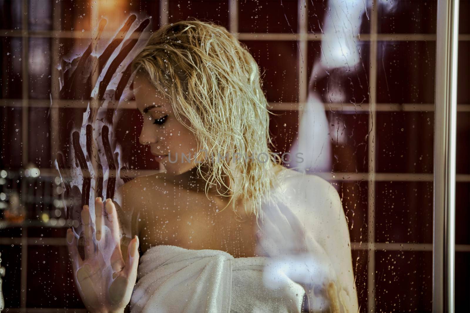 Sexy blonde girl with wet hair in the bathroom by studiodav