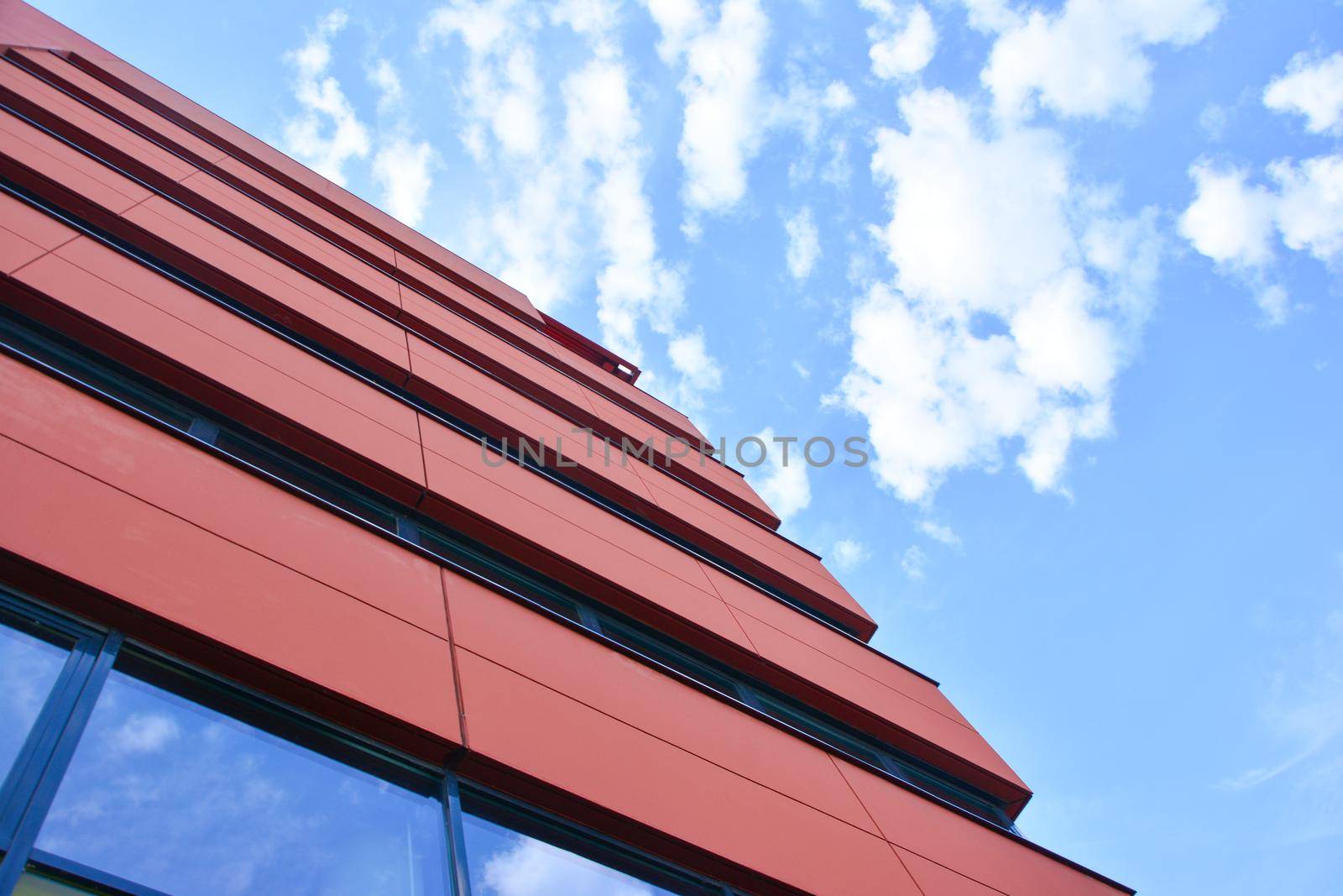 Modern red building with offices and glass windows
