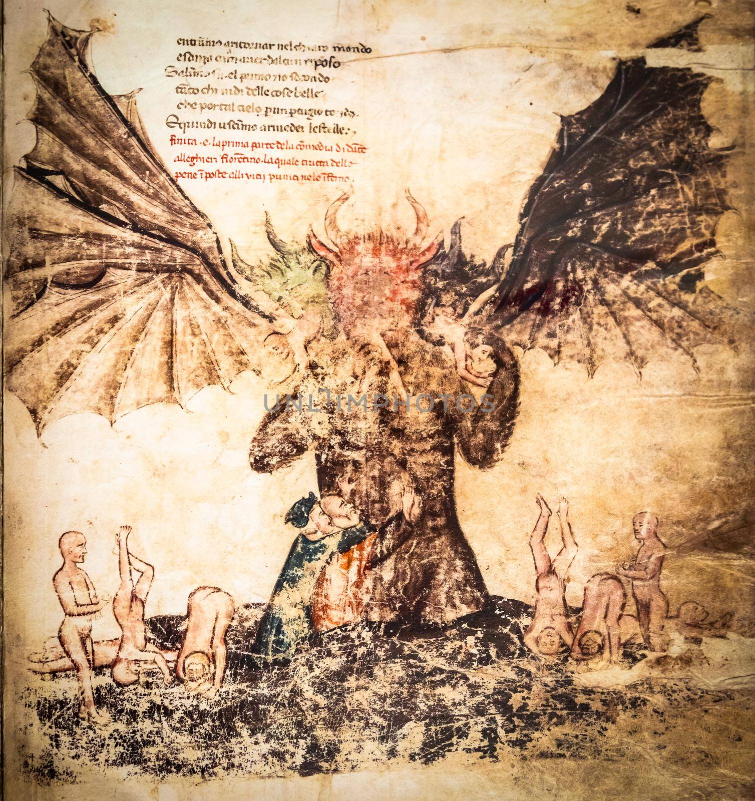 FLORENCE, ITALY - circa July 2021. Antique manuscript sheet from a gothic book with satanic hell illustration, 16th Century copy.