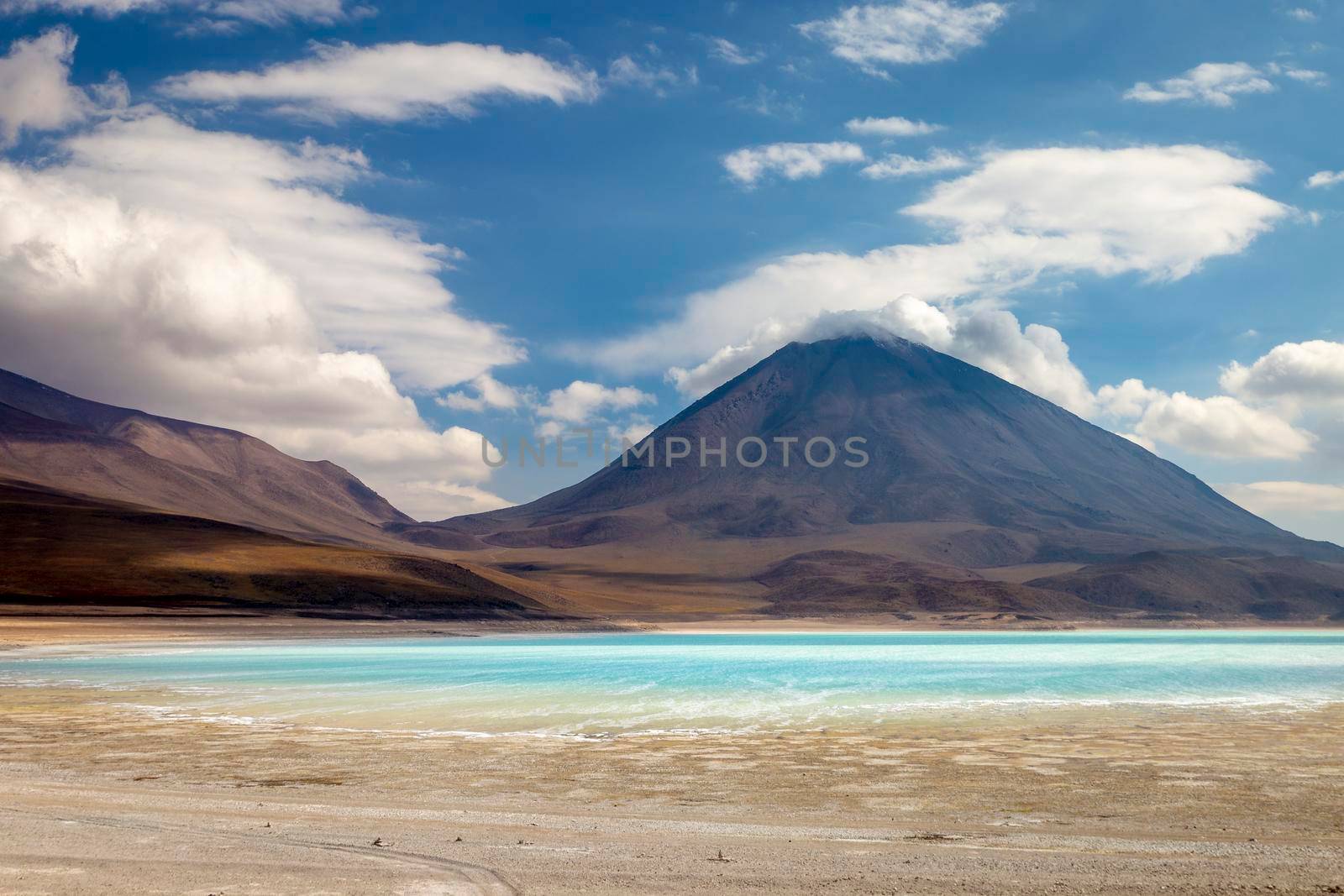 Licancabur and Laguna Verde, green Lagoon at dramatic sky in Altiplano of Bolivia, South America