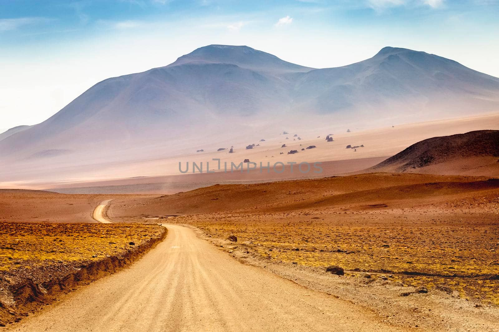 Country road in Atacama desert, volcanic arid landscape in Northern Chile border with Bolivia, South America