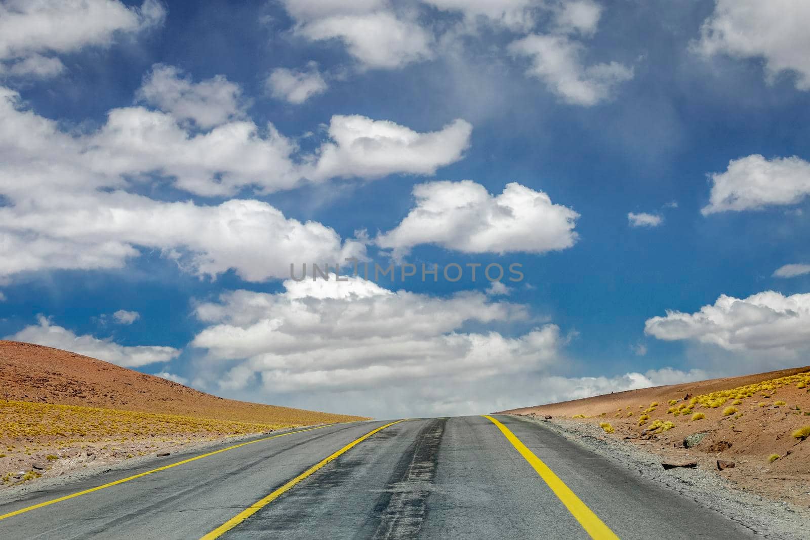 Country road in Atacama desert, volcanic arid landscape in Northern Chile border with Bolivia, South America