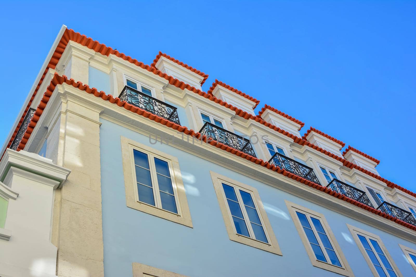 Historic facade in Lisbon painted in blue, Portugal