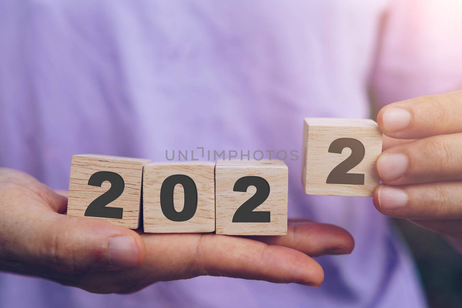 Hand hold wooden cubes 2022 background, copy space. Goal concept, action plan, strategy, new year. by Suwant