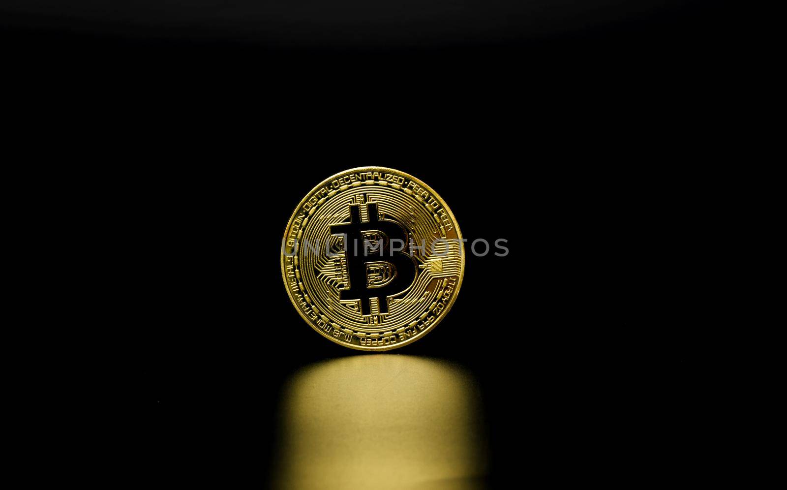 Gold Bitcoin on black background. Cryptocurrency coin by Buttus_casso