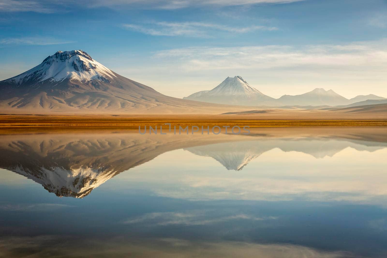 Idyllic Lake Lejia reflection and volcanic landscape in Atacama desert, Northern Chile, South America
