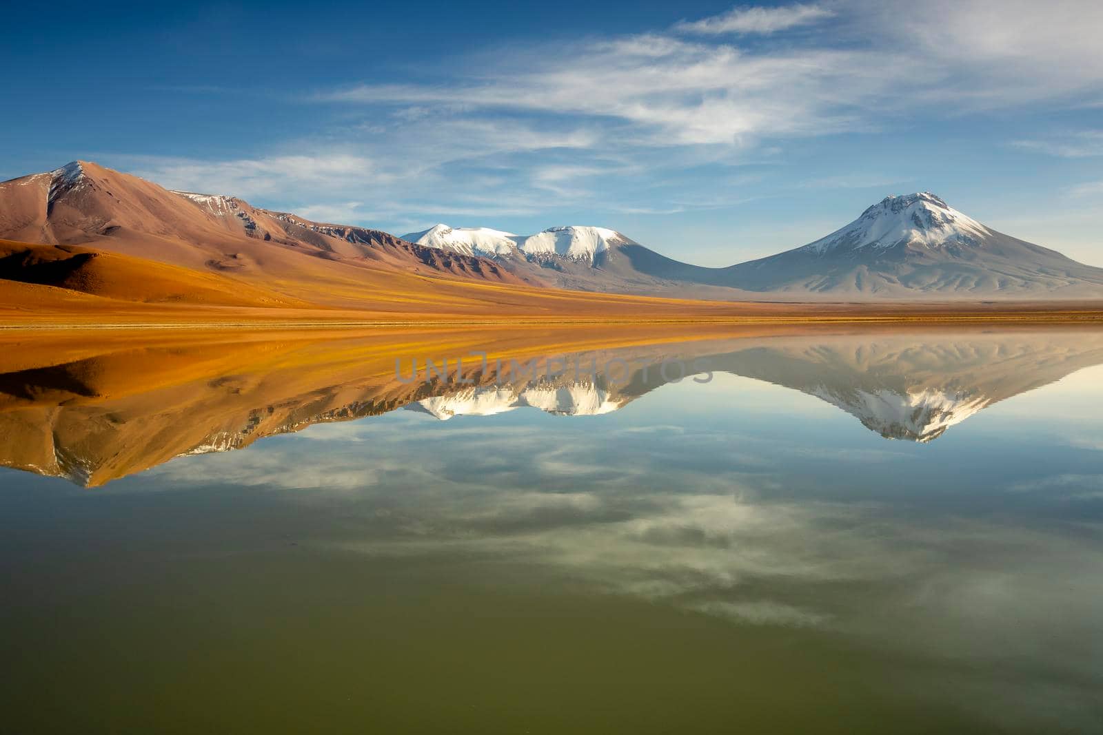 Idyllic Lake Lejia reflection and volcanic landscape in Atacama desert, Northern Chile, South America