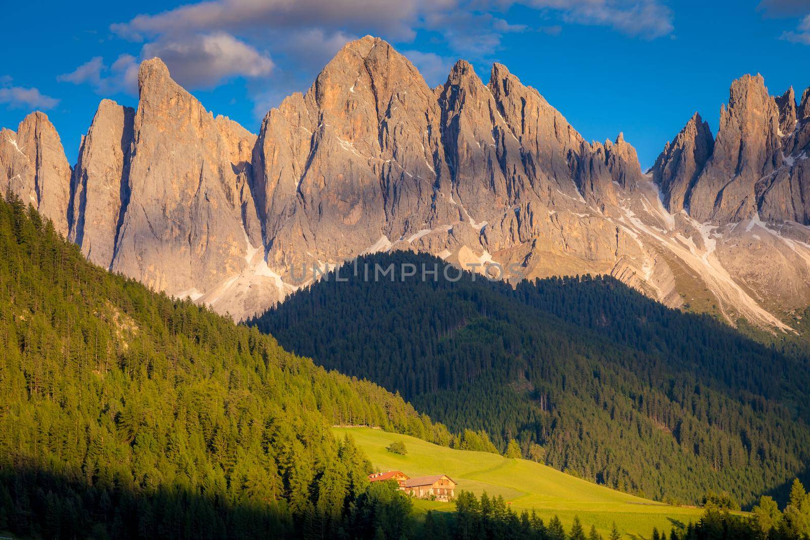 St. Magdalena in Funes valley with pinnacles at dramatic sunset, Dolomites , Italy