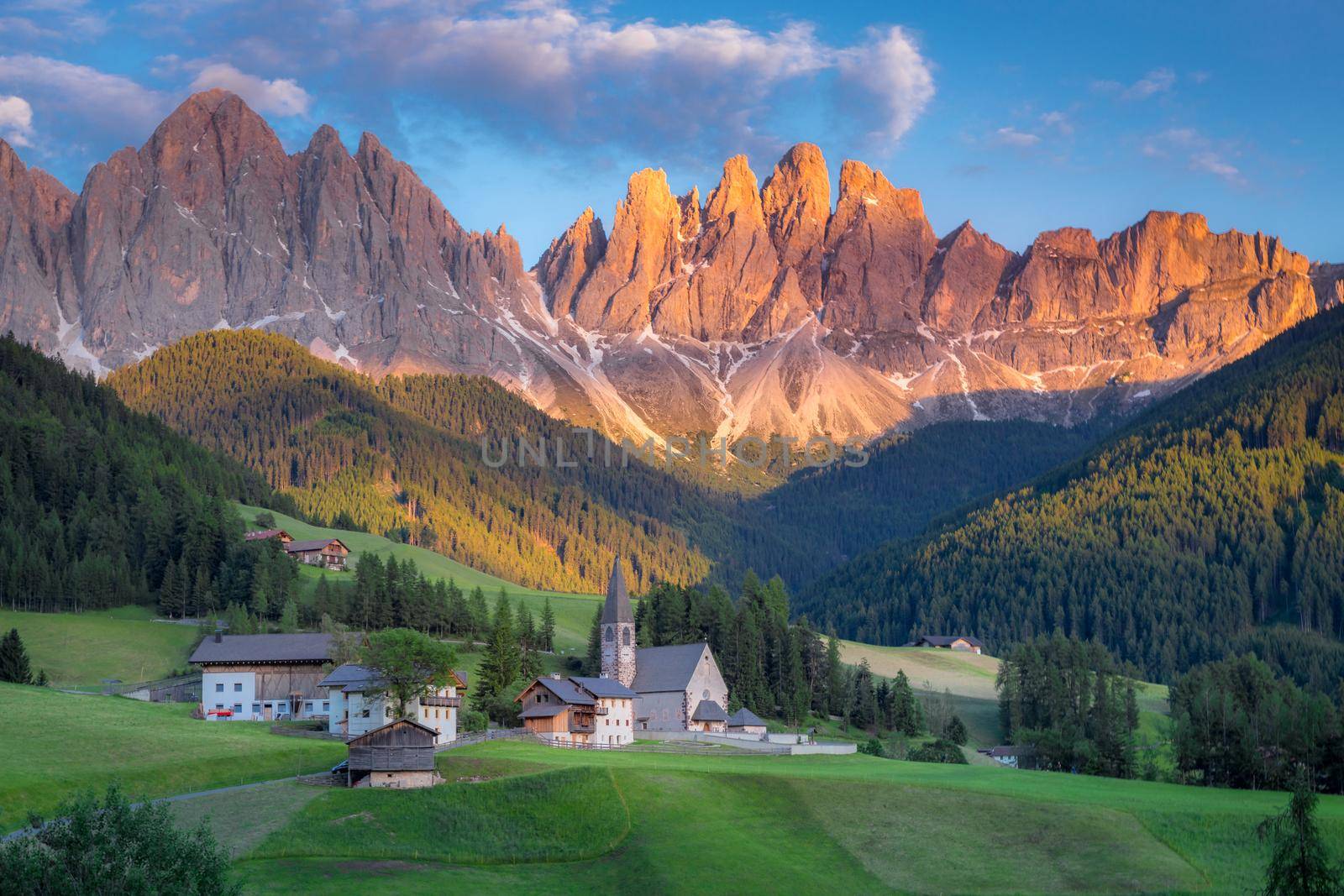 St. Magdalena village with famous church in Val di Funes at sunset, Dolomites , Italy