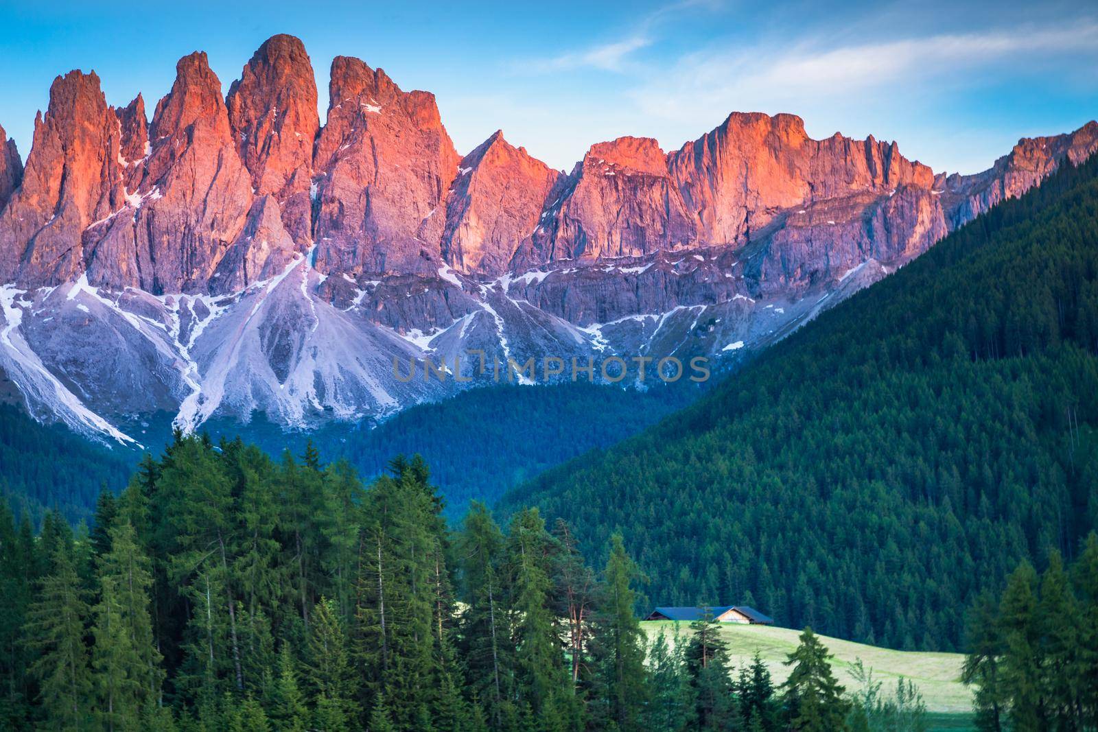 St. Magdalena in Funes valley with pinnacles at dramatic sunset, Dolomites , Italy