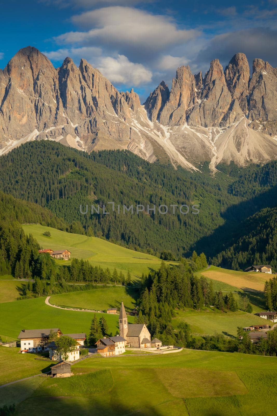 St. Magdalena village with famous church in Val di Funes at sunset, Dolomites , Italy