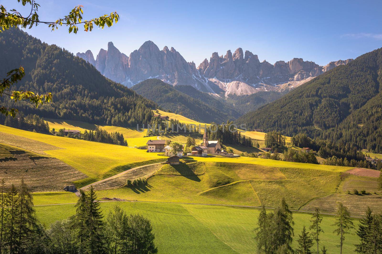 Idyllic St. Magdalena village with famous church in Val di Funes, Dolomites, Northern Italy