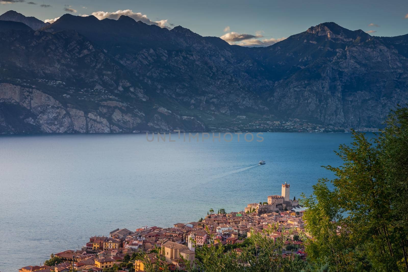 Above idyllic Lake Garda in Malcesine at dramatic dawn, Italian alps, long exposure