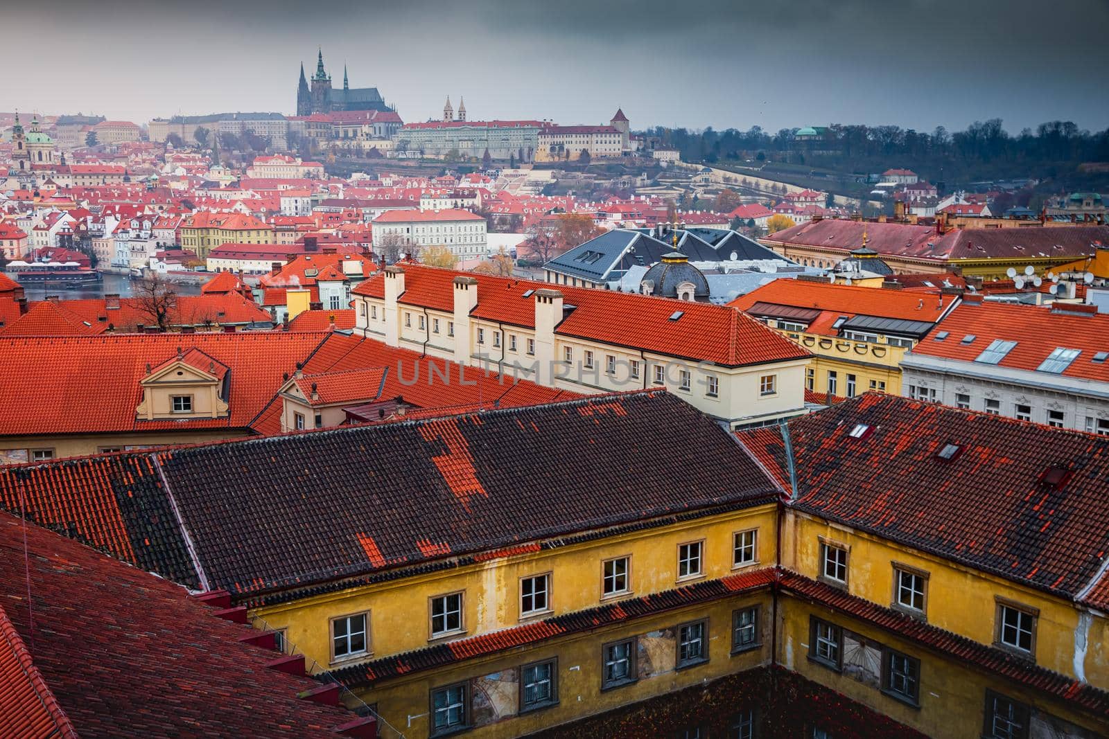 Above medieval Prague old town towers and domes at evening, Czech Republic