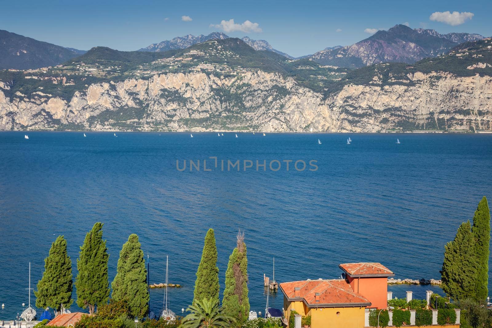 Idyllic lake Garda coastline in Malcesine and mountains, Northern Italy