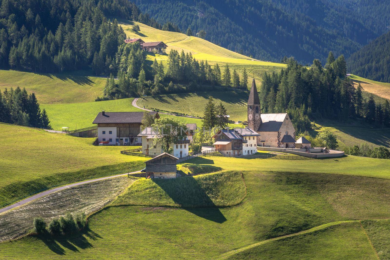 Idyllic St. Magdalena village with famous church in Val di Funes, Dolomites, Northern Italy