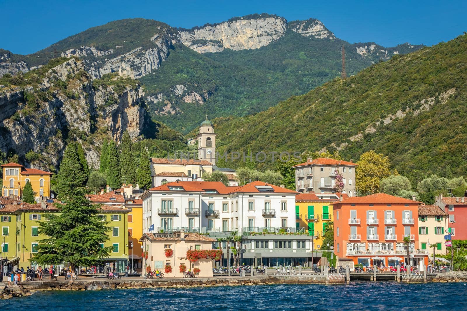 Idyllic Lake Garda in Riva del Garda old town coastline at sunset, Italian alps