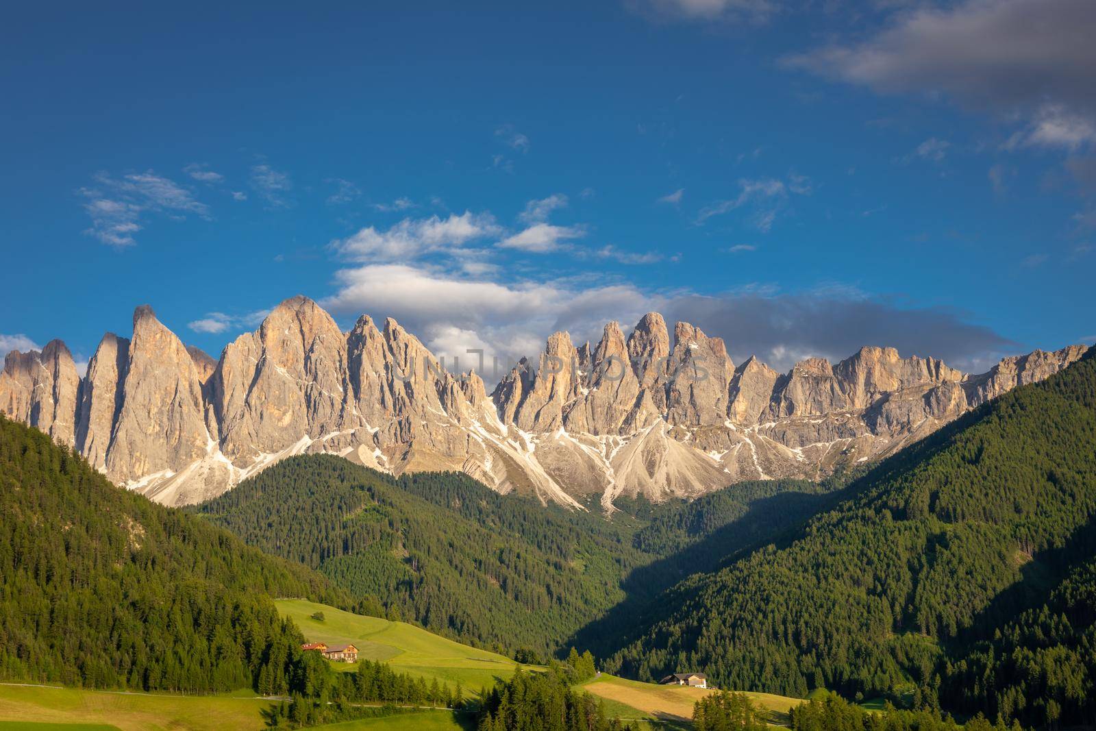 St. Magdalena in Funes valley with pinnacles at dramatic sunset, Dolomites , Italy