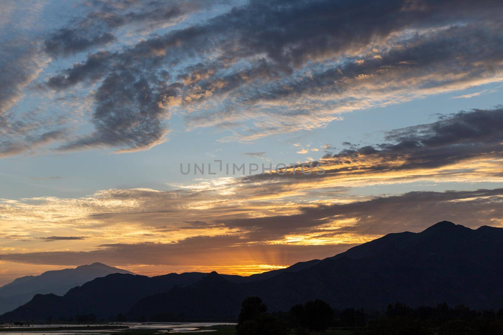 Sunset over a mountains in the swat valley, Pakistan by Bilalphotos